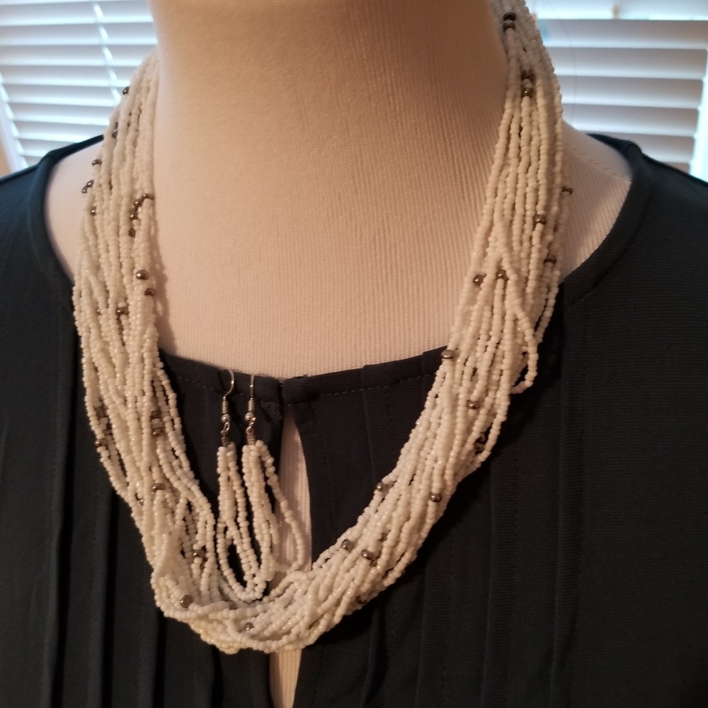 Cute necklace and earrings. White and black beads.
